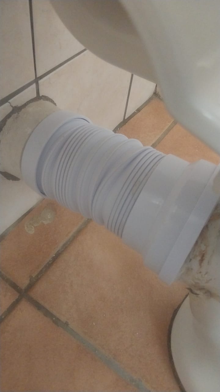 Leaking toilet pan connector in Randpark Ridge showing flexible waste pipe replaced to stop water seeping from toilet base and restore proper drainage