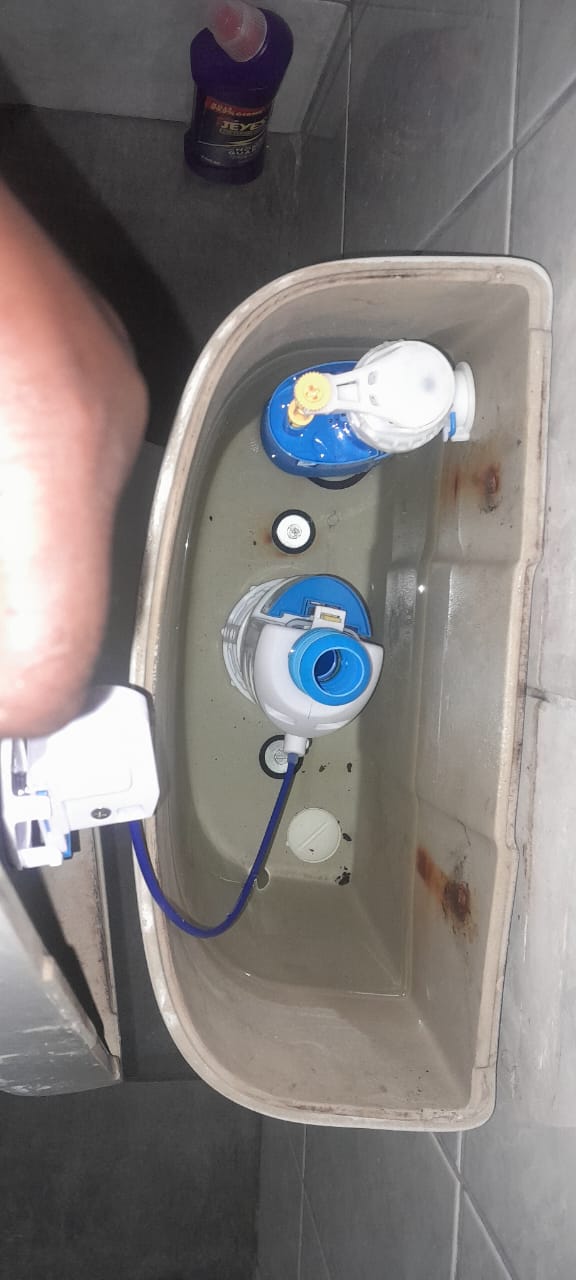 Close-up of blocked gulley with standing water and debris in Germiston