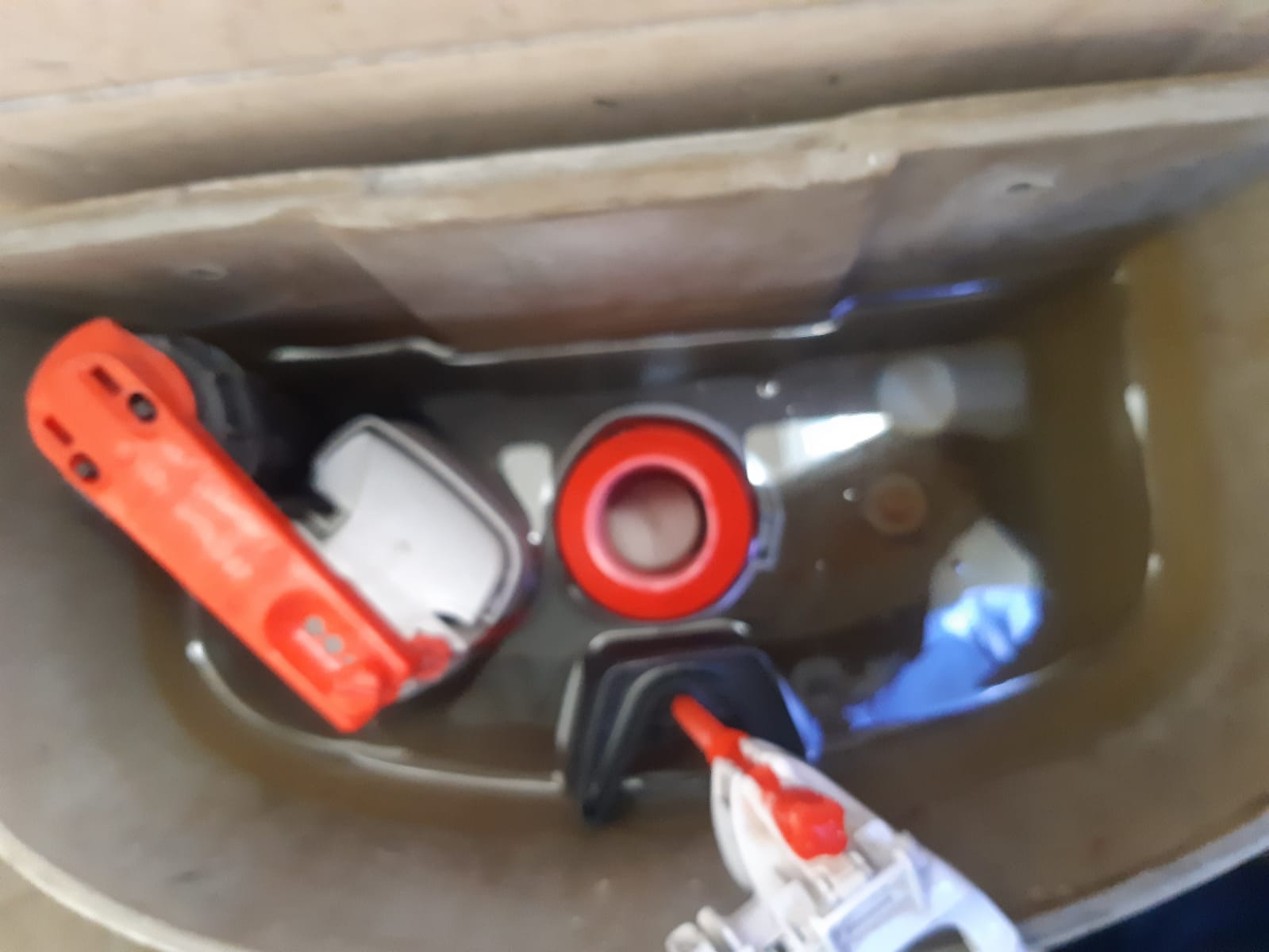 Leaking toilet cistern in Randpark Ridge showing faulty internal flush and fill valve components causing continuous running water before repair and replacement