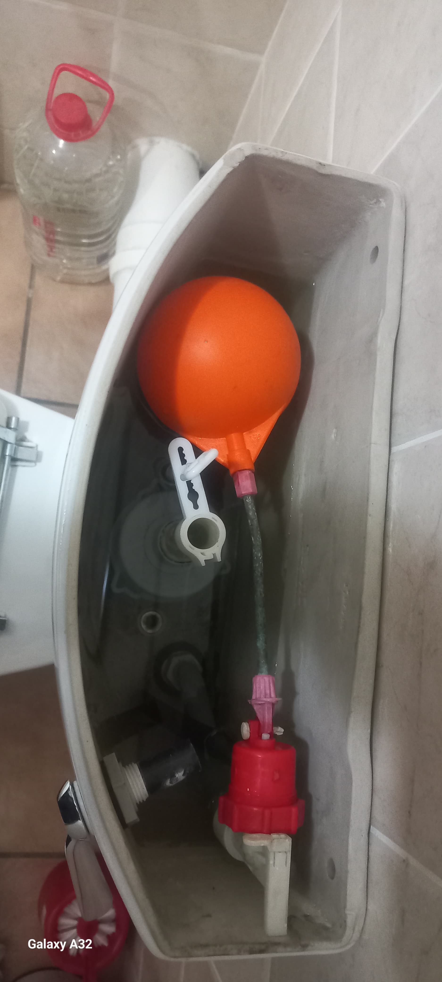 Toilet cistern in Glen Marais showing new ball valve and float installed during leaking toilet repair and internal flush mechanism maintenance.