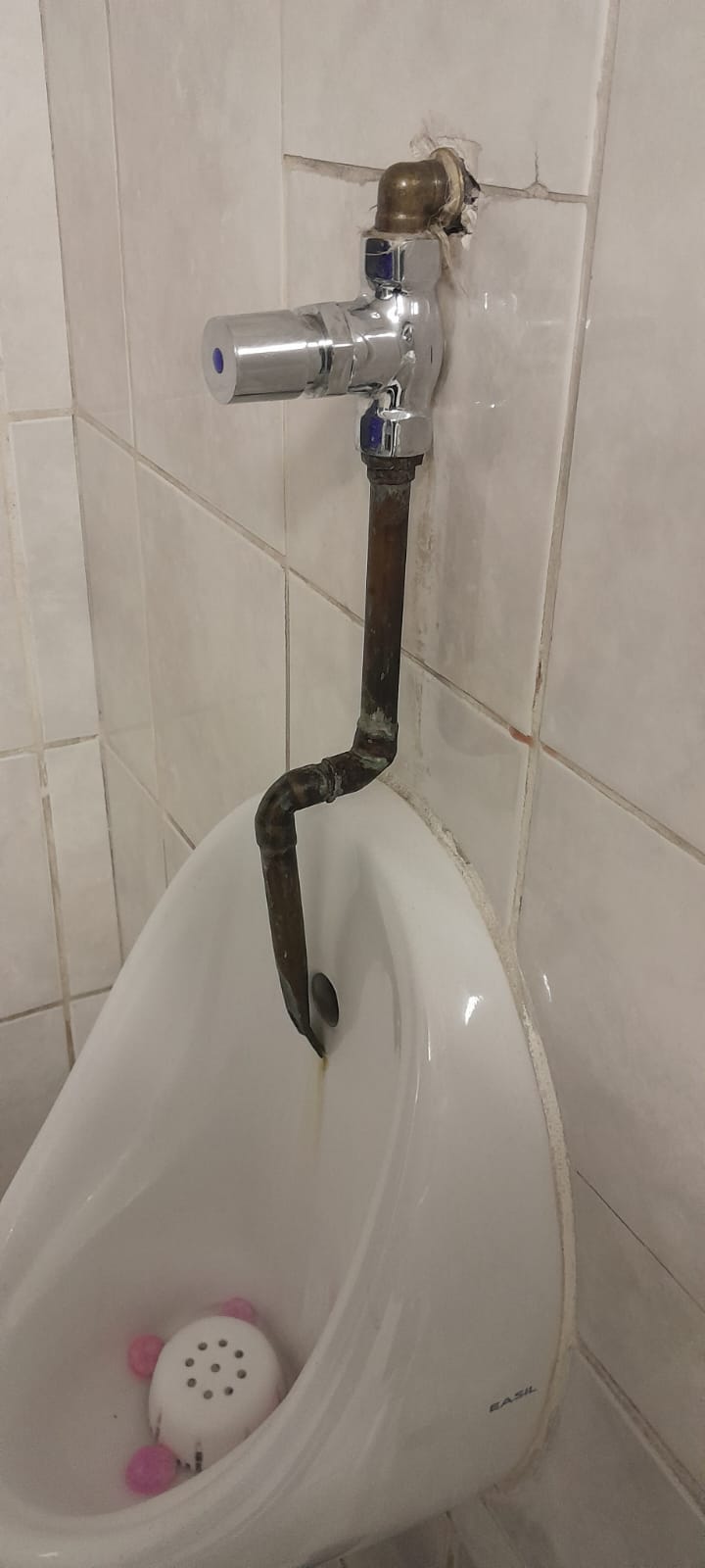 Leaking urinal flush valve and corroded pipe in Northcliff causing continuous water flow and pooling before plumbing repair restored proper flushing operation