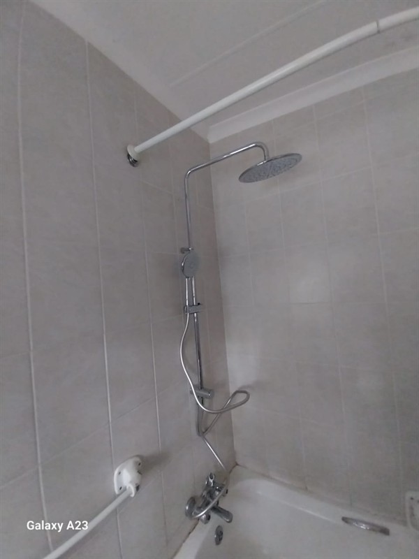 Open hot water geyser during thermostat and element repair in Kya Sand with internal components visible