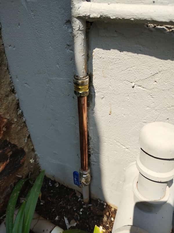 Gushing and soaked ground from burst outside pipe in Magaliesburg