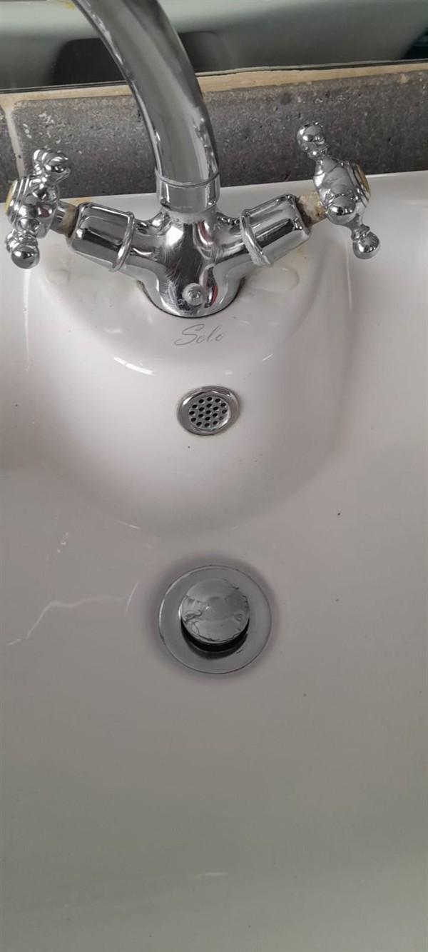 Open hot water geyser during thermostat and element repair in Erand with internal components visible