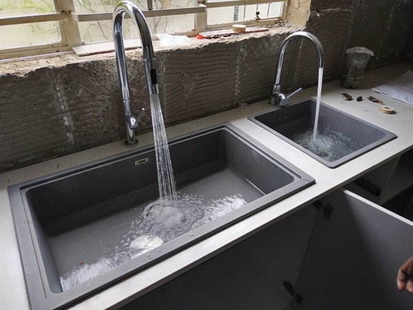 Technician repairing open geyser element and thermostat in Rosebank with exposed wiring and heating components