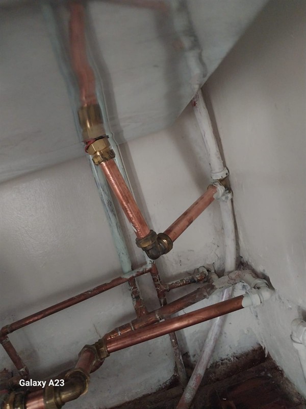 Ongoing dripping and stains from burst pipe in ceiling in Montgomery Park