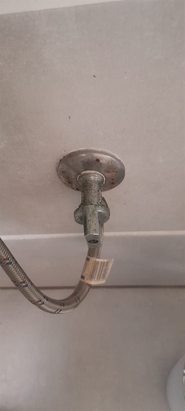 Faulty valve being swapped on toilet line
