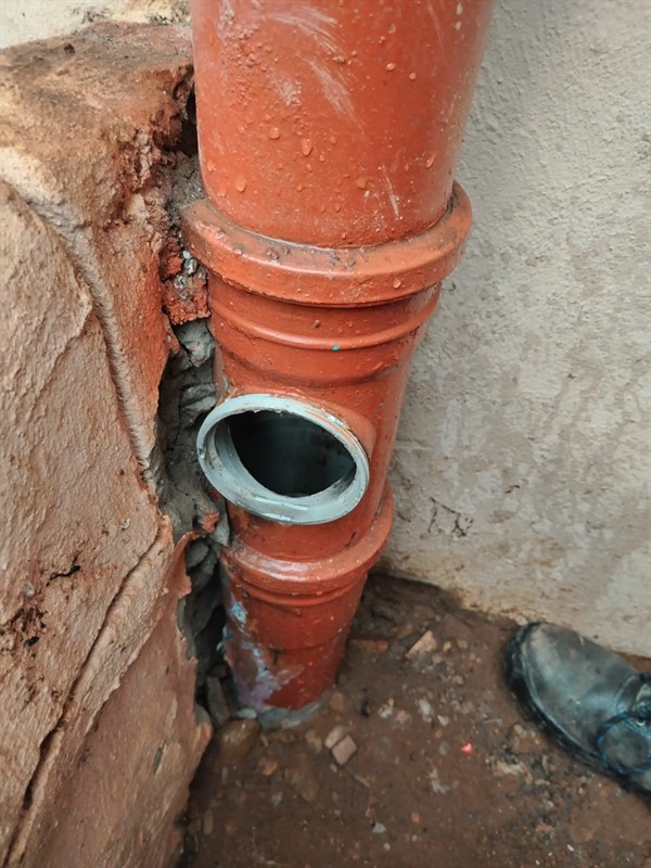 Clogged sewer pipe with waste accumulation