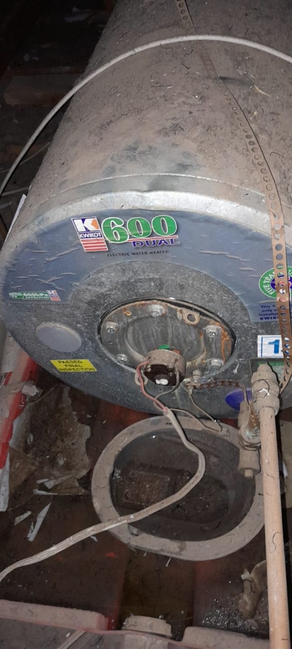 Open geyser showing heating element and thermostat repair work in Northcliff with exposed wiring and internal components