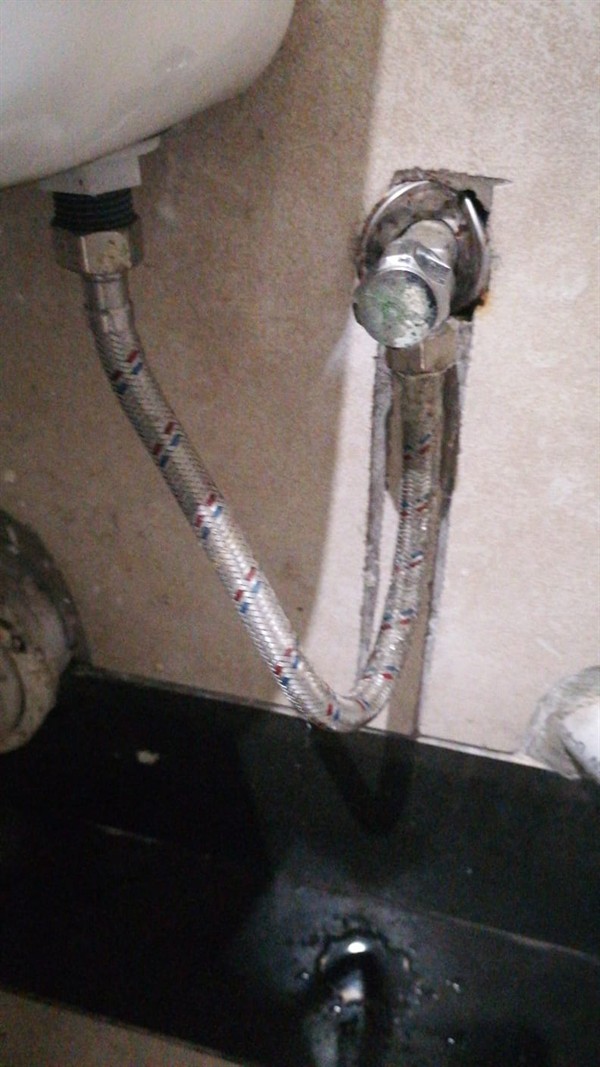 Seeping water onto floor from toilet flexi pipe in Olympus