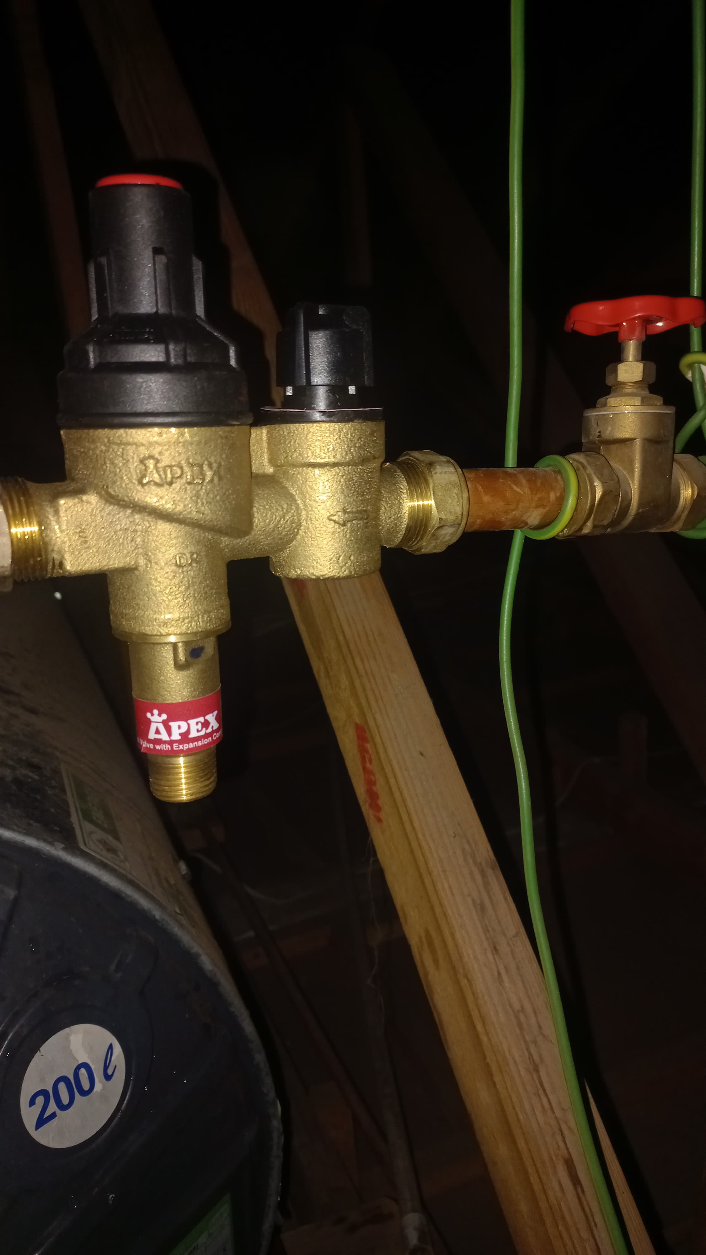 New pressure control valve installed in Kempton Park on geyser water line, showing brass valve assembly, isolation valve, and copper piping during plumbing repair and pressure regulation installation.