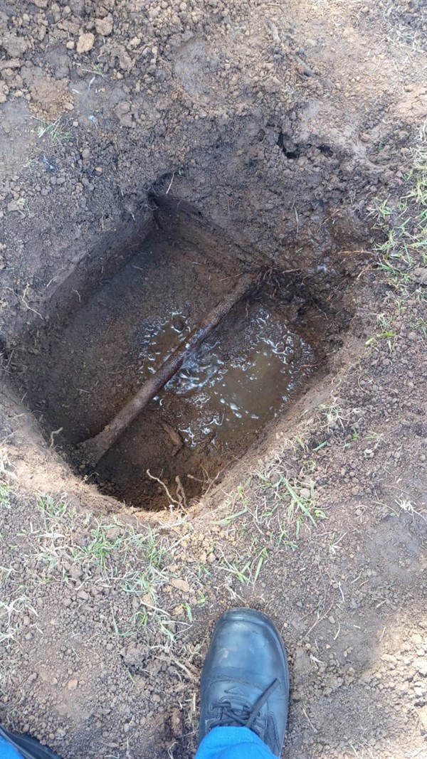Blocked drain showing visible debris and standing water inside