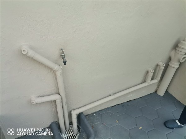 Blocked sewer pipe showing visible debris