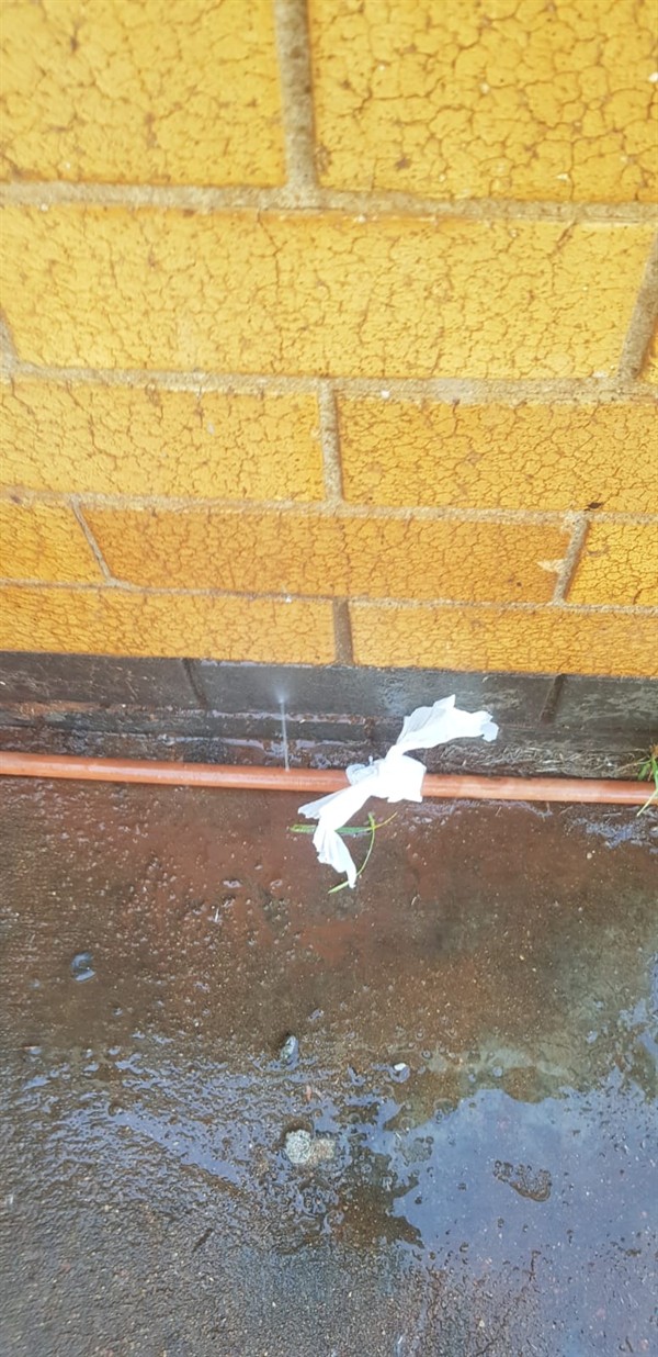 Flooded ground around burst outside pipe in Father Gerald