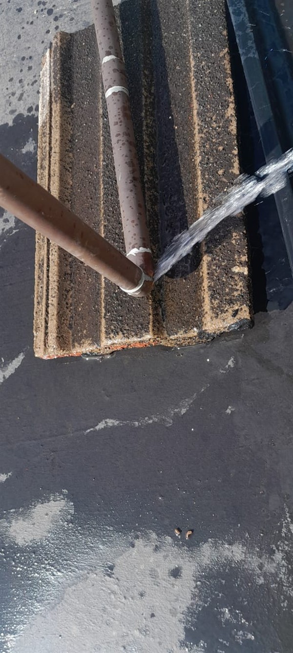 Growing wet patch from burst outside pipe in Kenmare