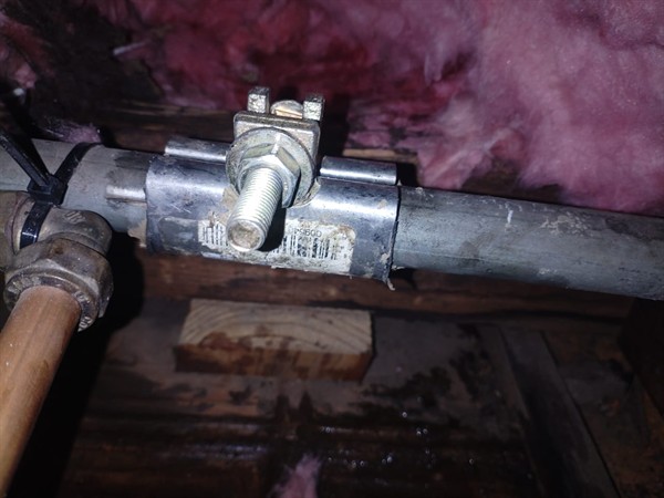 Burst pipe causing ceiling leak with visible water damage