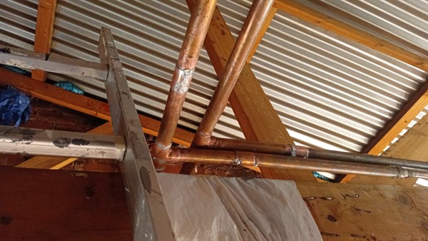 Ceiling stains from burst pipe leak in Percelia Estate