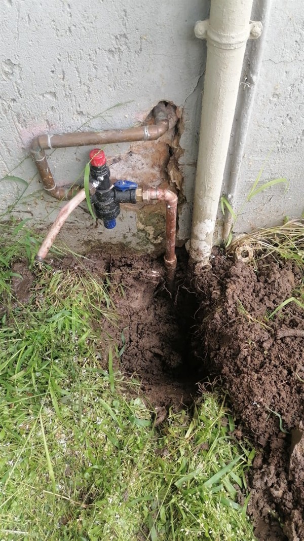 Water leaking from underground burst pipe causing higher bills in Willowild