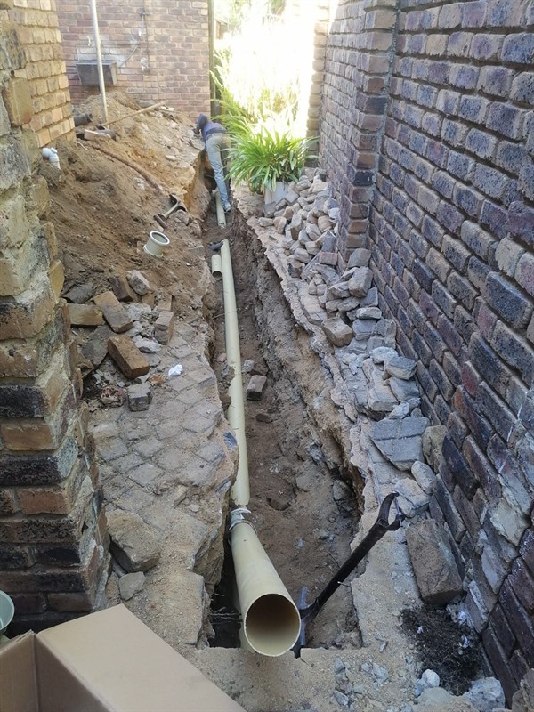 Faulty geyser element and thermostat repair in Germiston Central with open Geyser and visible components