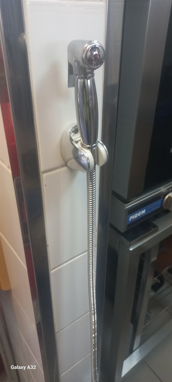 Open hot water geyser during thermostat and element repair in Linbro Park with internal components visible