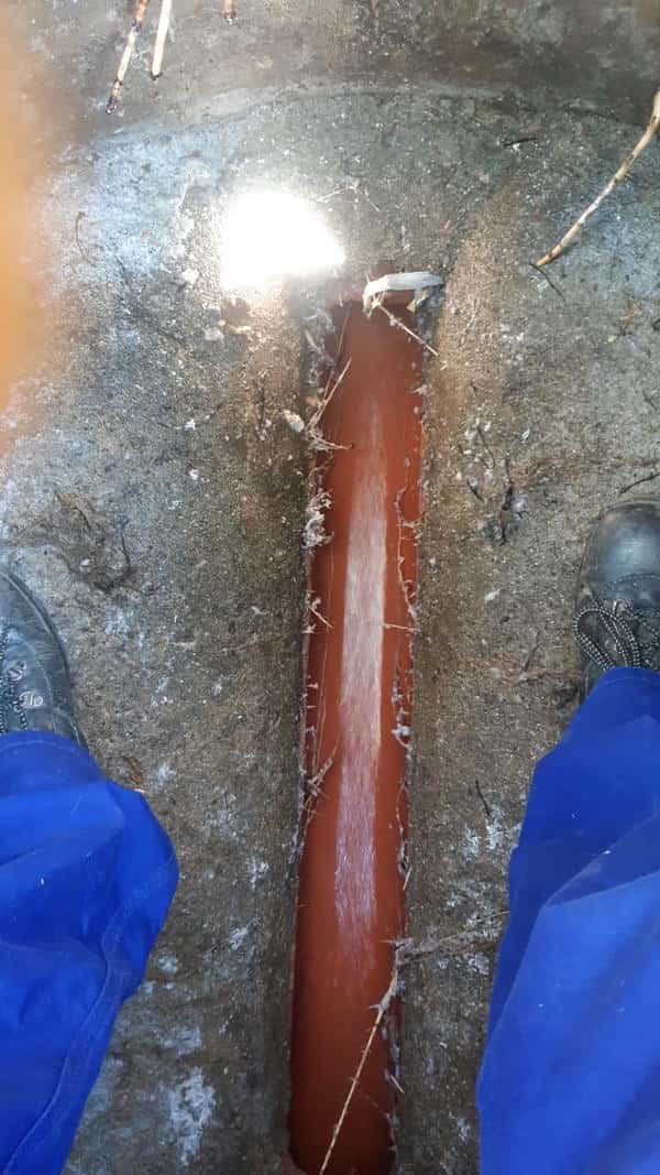 Clogged sewer line with waste accumulation