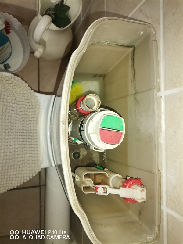 Technician repairing open geyser element and thermostat in Country Lane Estate with exposed wiring and heating components