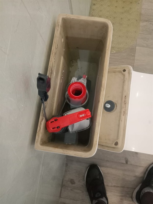 Open hot water geyser during thermostat and element repair in Loumarina with internal components visible