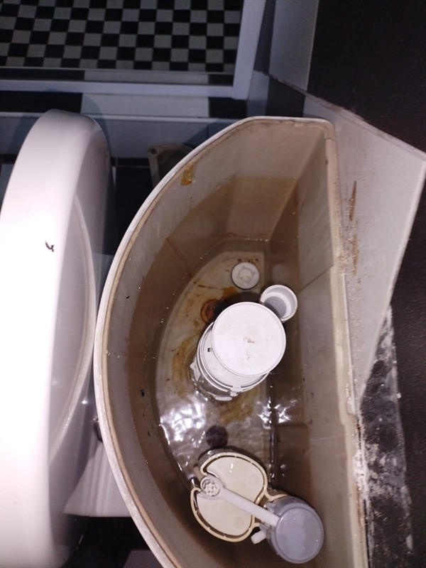 Open hot water geyser during thermostat and element repair in Fourways Central with internal components visible