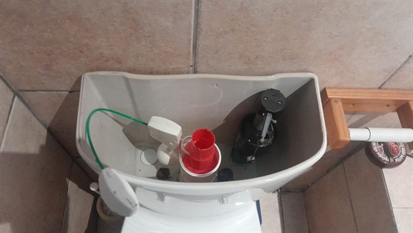 Ceiling mounted geyser opened during element and thermostat repair in Vleikop showing internal wiring