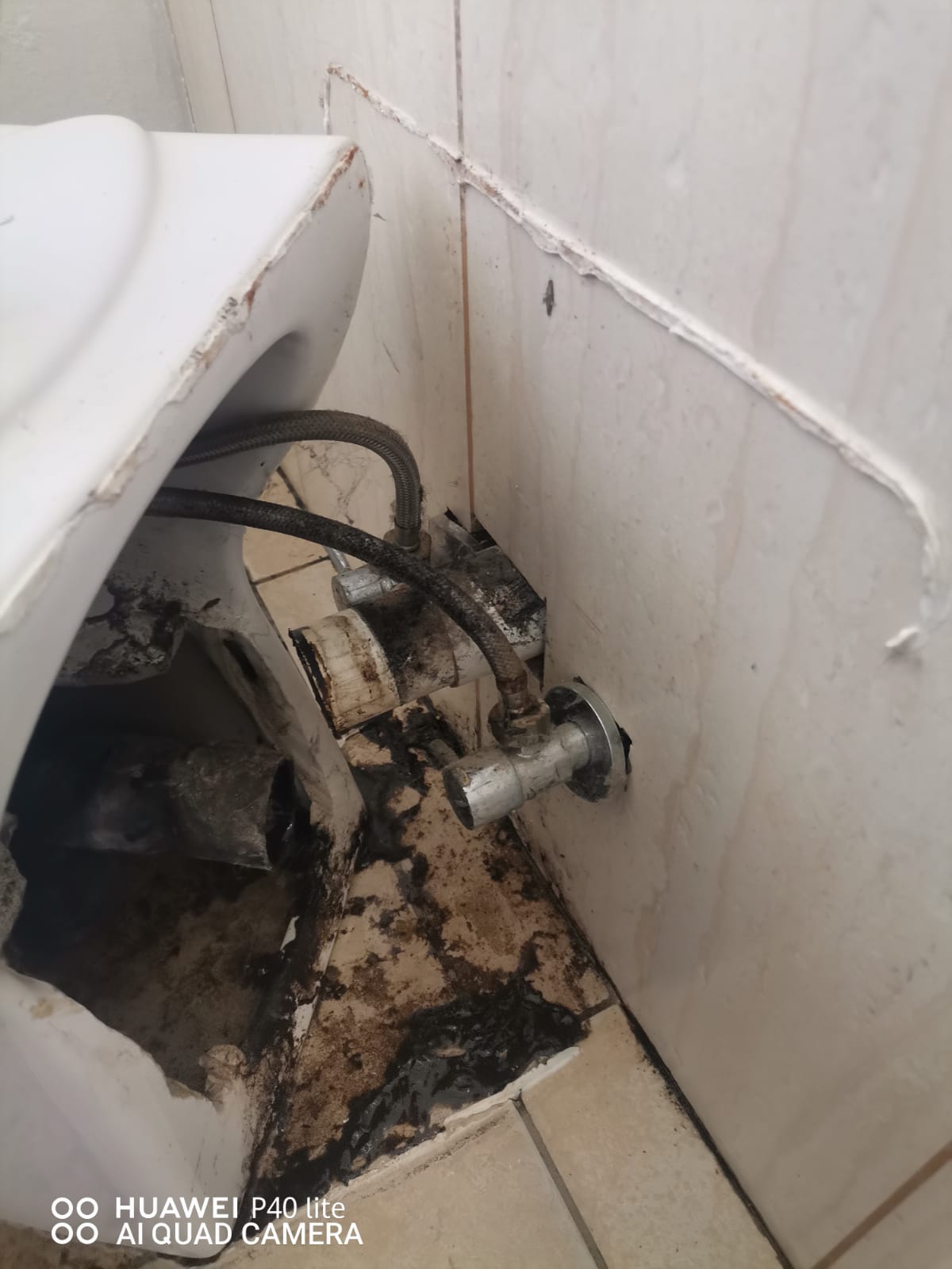 Old damaged toilet in Glen Marais with broken base and leaking waste connection, showing water damage and exposed pipework before toilet replacement to restore proper flushing, drainage, and safe bathroom operation.