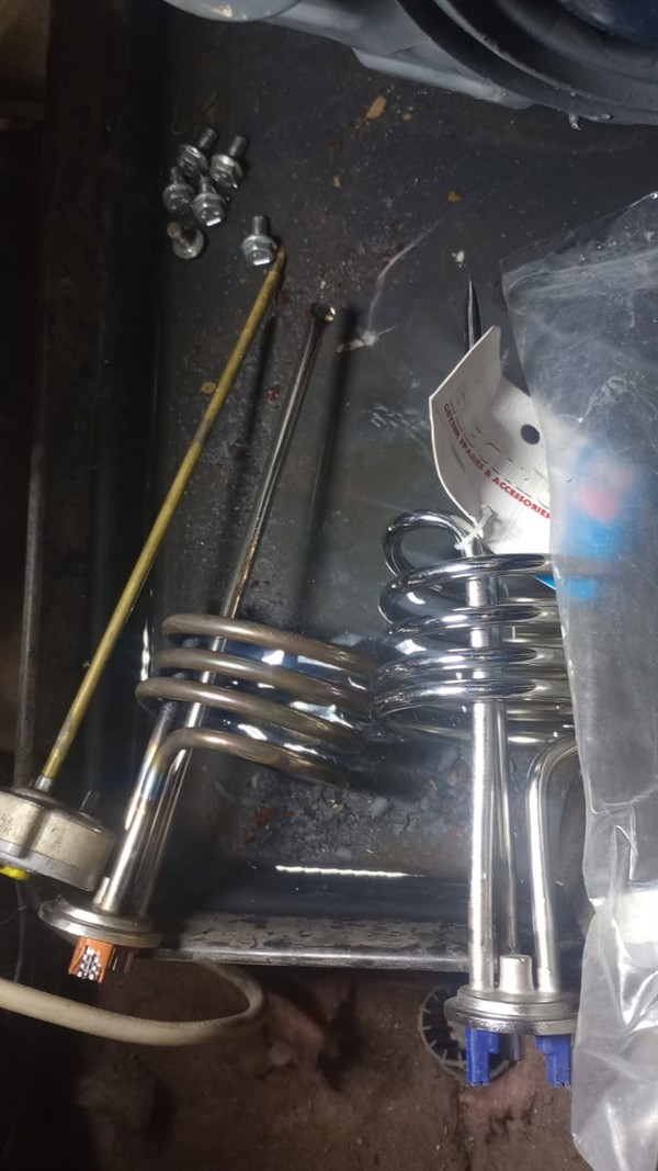 Ceiling mounted geyser opened during element and thermostat repair in Boksburg East Industrial showing internal wiring