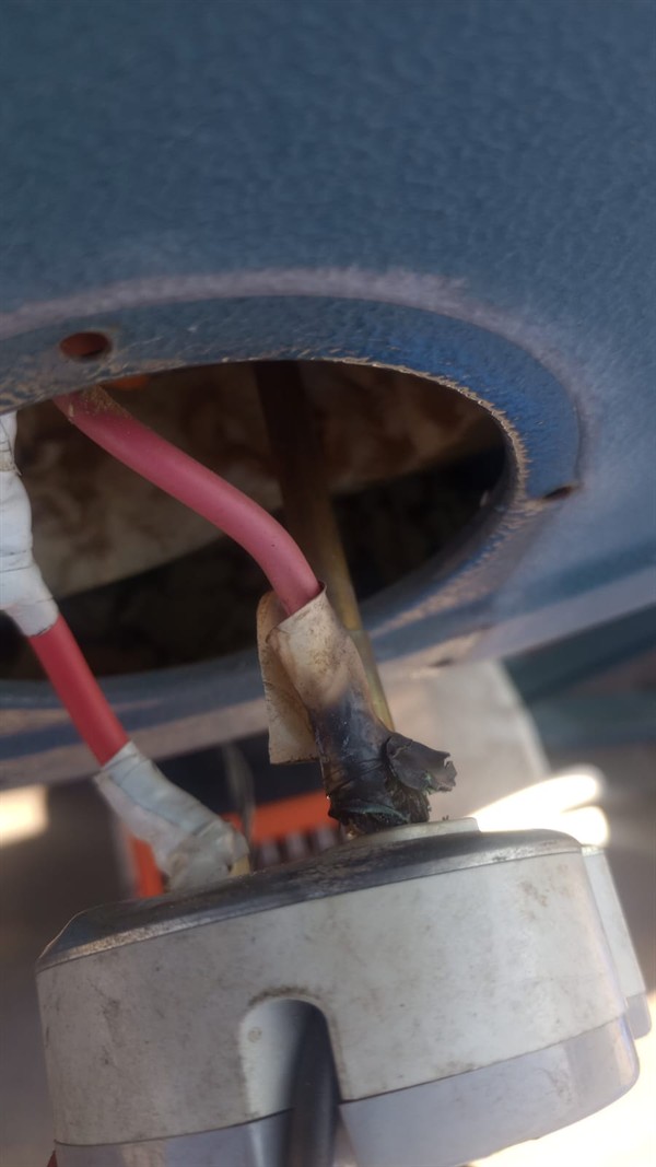Ceiling mounted geyser opened during element and thermostat repair in Aldarapark showing internal wiring