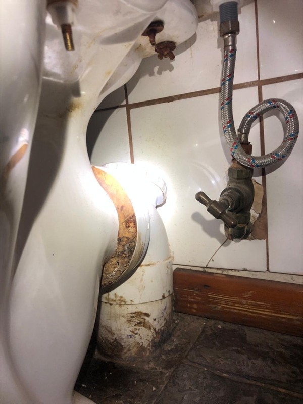 Faulty toilet angle valve showing drip