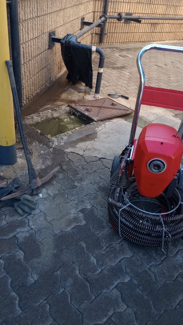 Slow draining drain pipe with water pooling around the opening