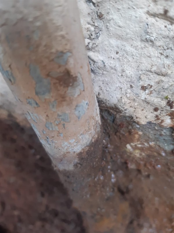 Spraying water from burst outside pipe in East Camp D Or Gold Mines