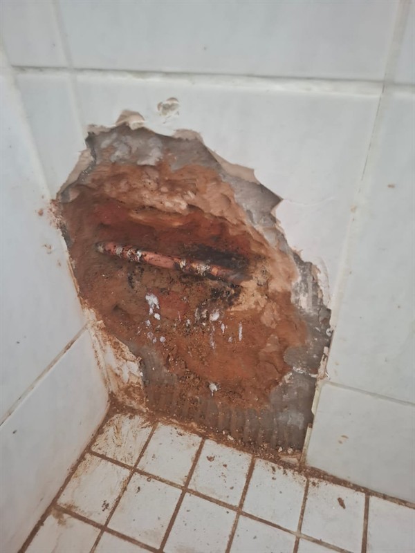 Burst pipe inside wall causing water leak in Pomona