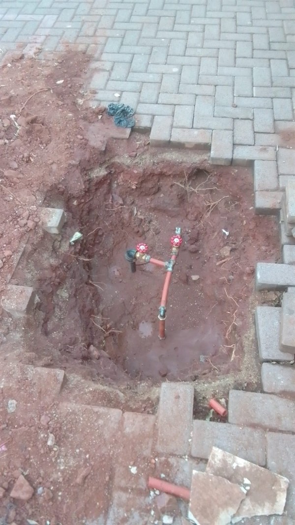 Wet patches appearing from burst underground pipe in Stasoft