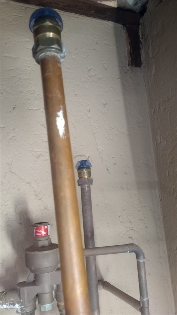 Ceiling mounted geyser opened during element and thermostat repair in Lenasia South showing internal wiring