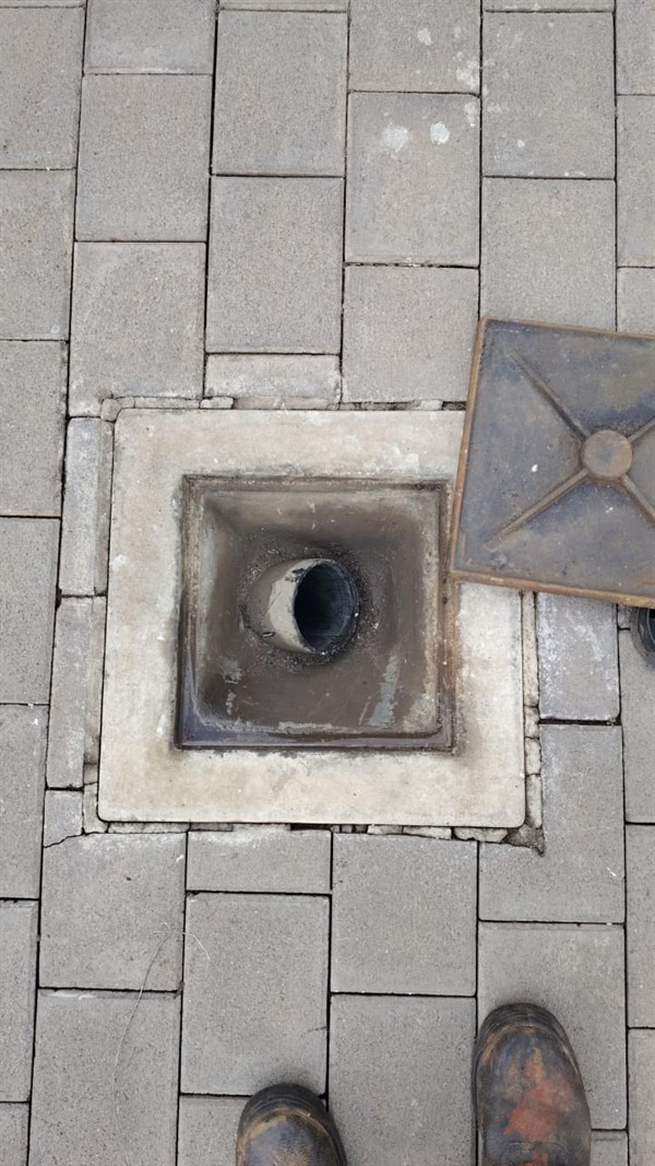 Sewer line with waste backing up due to blockage in Vogelfontein