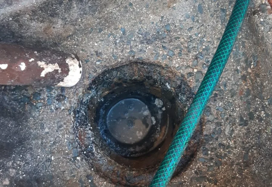 Outside Gully Blockage Cleaning Waterkloof showing an outside drain gully being cleared