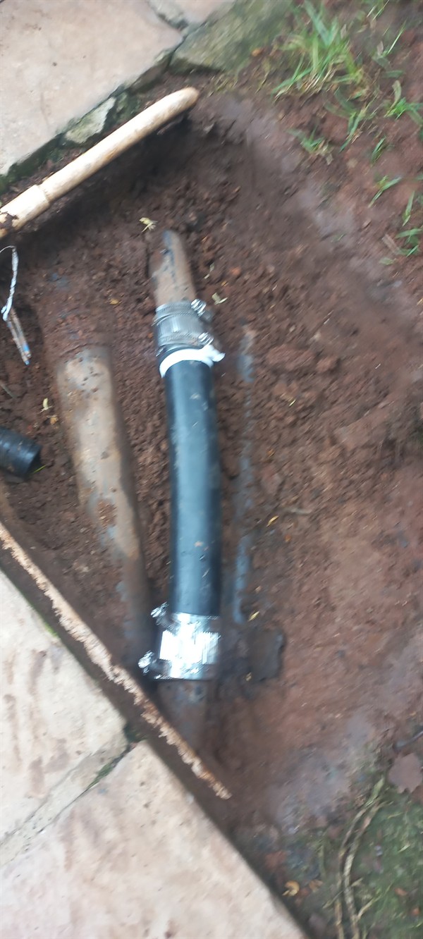 Wet patches appearing from burst underground pipe in Westcliff